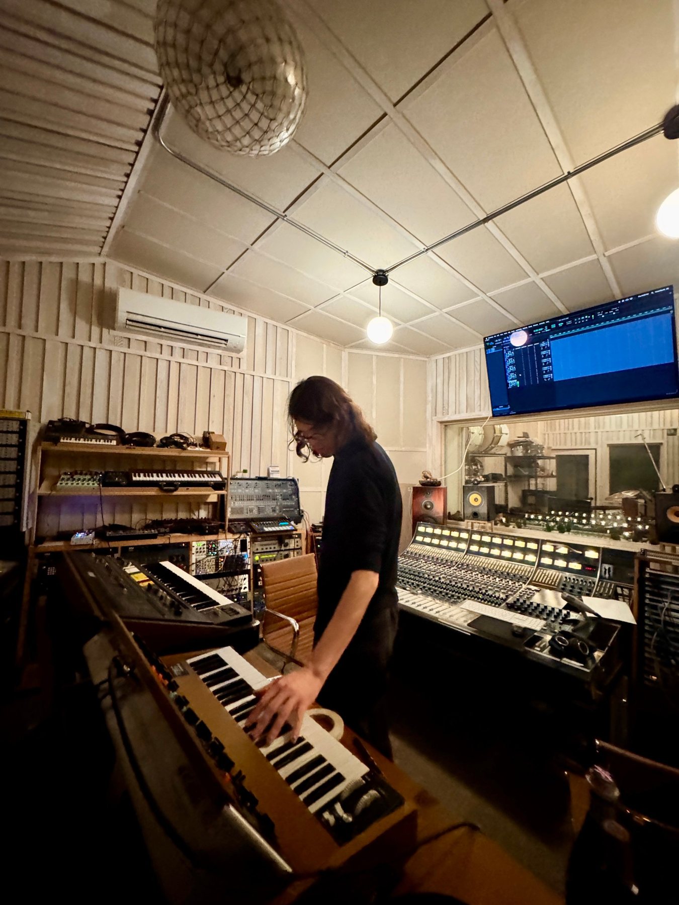 Control room with the Neve 8058, synths and Theo at a Minimoog